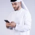 arab-man-using-phone-showing-600nw-2498549337